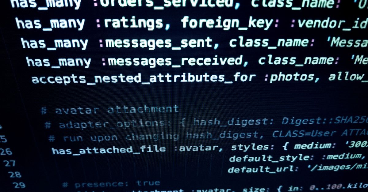 Code displayed on a computer monitor in a darkened room — photo by Digital Buggu on Pexels